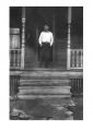Joseph Timko Sr standing on the front porch of the house at 481 Oriole Street.jpg